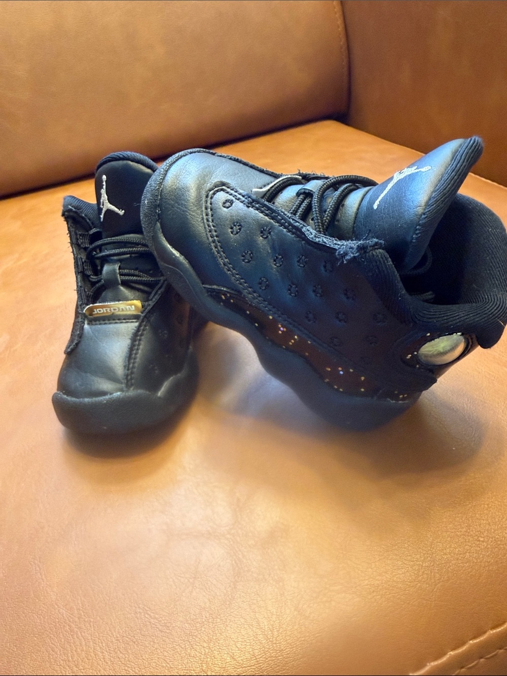Jordan Kids Black Retro Sneakers with Metallic Accents